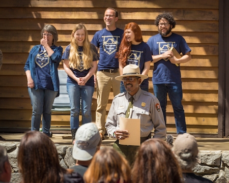 Ranger Shelton Johnson (center) with troupe members on stage.